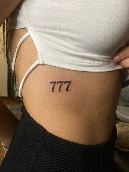 777 Tattoo On Rib
