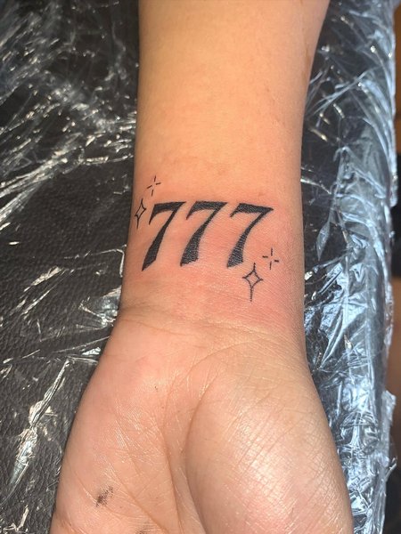 777 Tattoo On Wrist