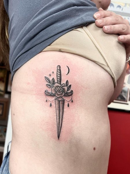 Dagger Tattoo On Rib