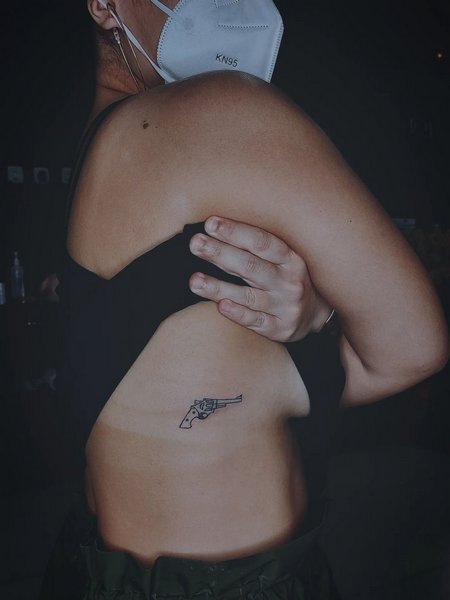 Gun Tattoo On Rib Cage