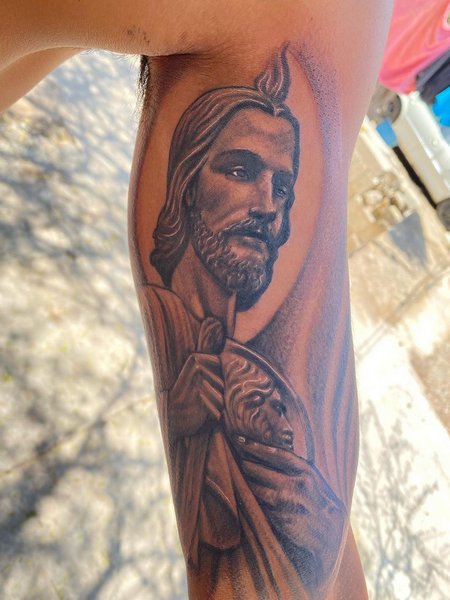 San Judas Tattoo On Biceps