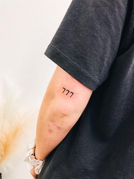 Simple 777 tattoo