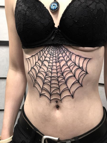 Spider Tattoo On Sternum