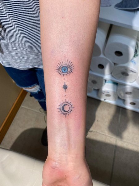 Sun Star and Evil Eye Tattoo