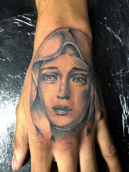 Virgin Mary Hand Tattoo