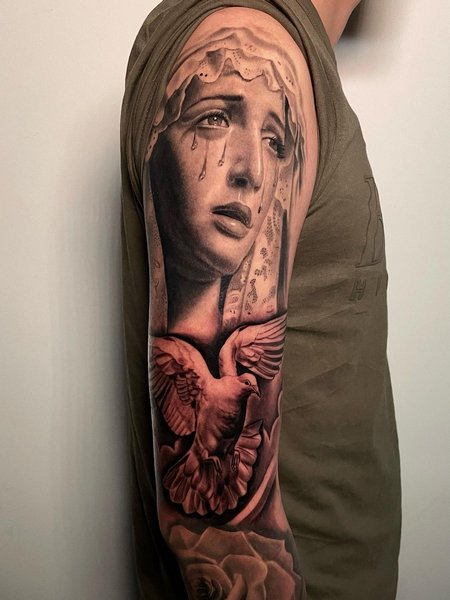 Virgin Mary Sleeve Tattoo