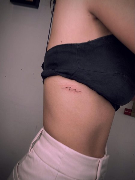 Wave Tattoo On Rib