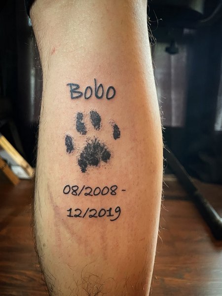 Meaningful Paw Print Tattoo