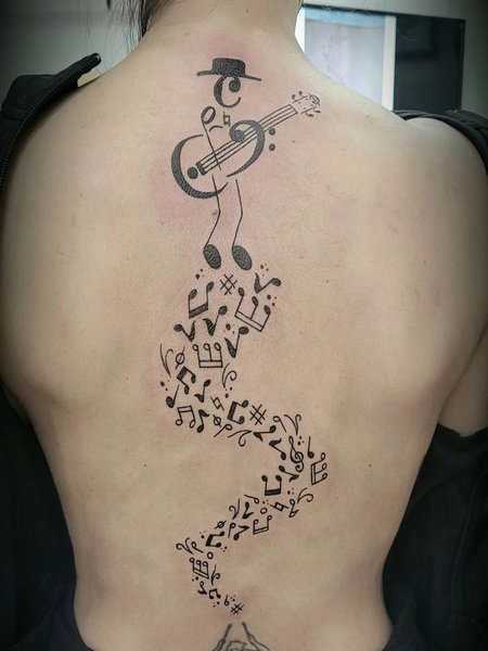 Music Note Spine Tattoo