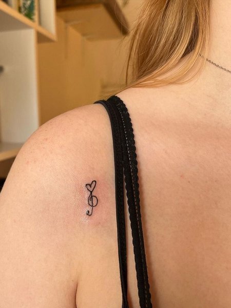 Tiny Music Note Tattoo