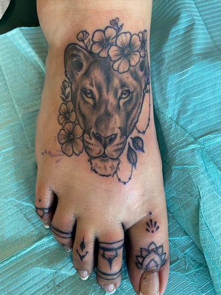 Lioness Foot Tattoo