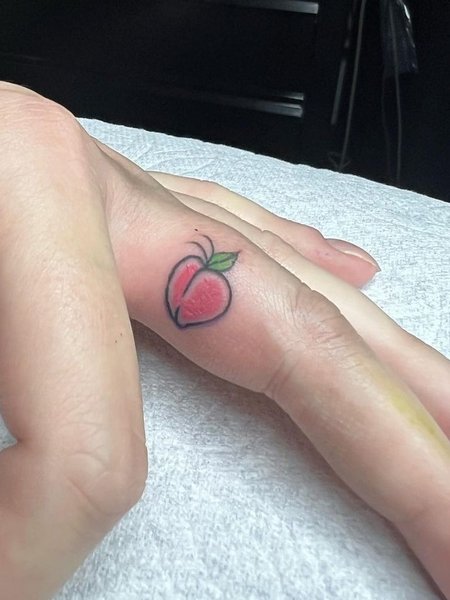 Peach Finger Tattoo